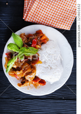 Chicken meat with mushroom sauce on a rice pad. Chicken meat with mushroom sauce on a rice pad. 123601832