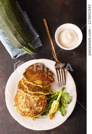 Potato pancakes with zucchini on white plate 123601842