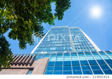 A modern office skyscraper at sunny day A modern office skyscraper at sunny day 123601914