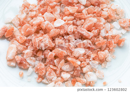 Image of pink Himalayan salt on white background Image of pink Himalayan salt on white background 123602802
