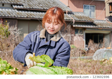 Woman working in the fields, country life, home garden 123602896