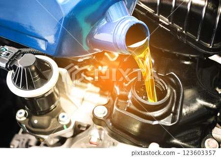 Refueling and pouring oil quality into the engine motor car Transmission and Maintenance Gear .Energy fuel concept. 123603357