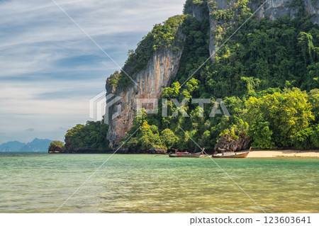 Tropical islands view with long tail boat ocean blue sea water and white sand beach at Koh Phak Bia, Krabi Thailand nature landscape Tropical islands view with long tail boat ocean blue sea water and white sand beach at Koh Phak Bia, Krabi Thailand nature landscape 123603641