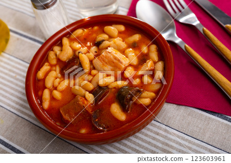 Beans stewed with pork, blood sausage and chorizo in clayware 123603961