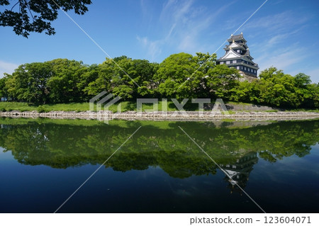 Symmetry of Okayama Castle tower seen from the right bank of Asahikawa River against the backdrop of a clear blue sky in May Ver3 Symmetry of Okayama Castle tower seen from the right bank of Asahikawa River against the backdrop of a clear blue sky in May Ver3 123604071