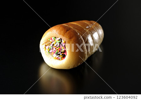 Chocolate cornet photographed alone against a black background 123604092