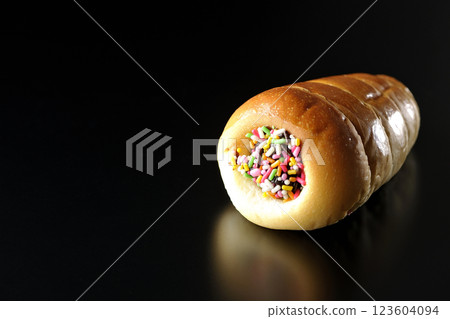 Chocolate cornet photographed alone against a black background Chocolate cornet photographed alone against a black background 123604094