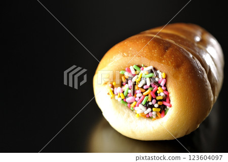 Chocolate cornet photographed alone against a black background Chocolate cornet photographed alone against a black background 123604097