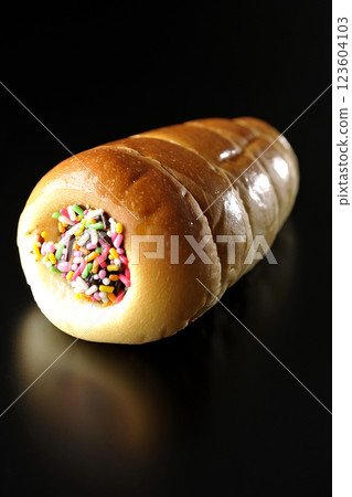 Chocolate cornet photographed alone against a black background Chocolate cornet photographed alone against a black background 123604103
