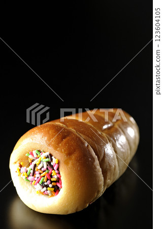 Chocolate cornet photographed alone against a black background Chocolate cornet photographed alone against a black background 123604105