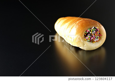 Chocolate cornet photographed alone against a black background 123604117