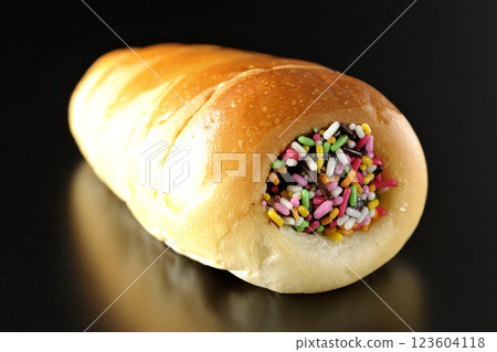 Chocolate cornet photographed alone against a black background Chocolate cornet photographed alone against a black background 123604118