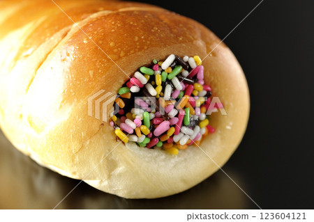 Chocolate cornet photographed alone against a black background 123604121