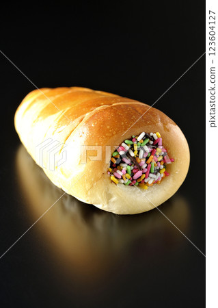 Chocolate cornet photographed alone against a black background Chocolate cornet photographed alone against a black background 123604127
