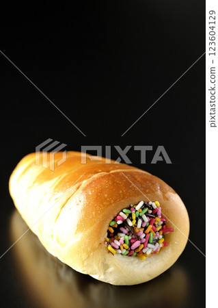 Chocolate cornet photographed alone against a black background Chocolate cornet photographed alone against a black background 123604129