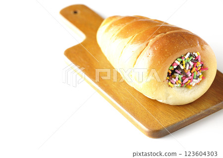 A chocolate cornet on a cutting board photographed alone on a white background A chocolate cornet on a cutting board photographed alone on a white background 123604303