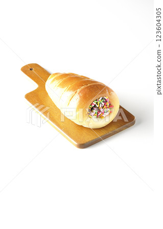 A chocolate cornet on a cutting board photographed alone on a white background A chocolate cornet on a cutting board photographed alone on a white background 123604305