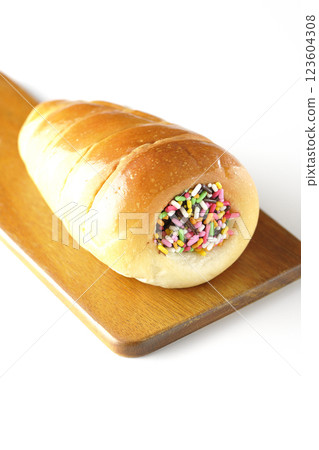 A chocolate cornet on a cutting board photographed alone on a white background A chocolate cornet on a cutting board photographed alone on a white background 123604308