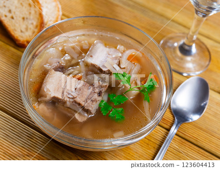 Shchi soup with beef served in bowl 123604413