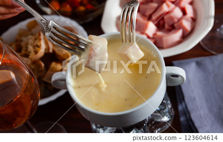 Cheese fondue with bread and snacks 123604614