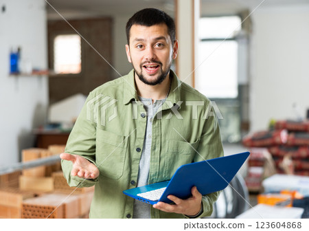 Owner checking home renovation plan on laptop 123604868