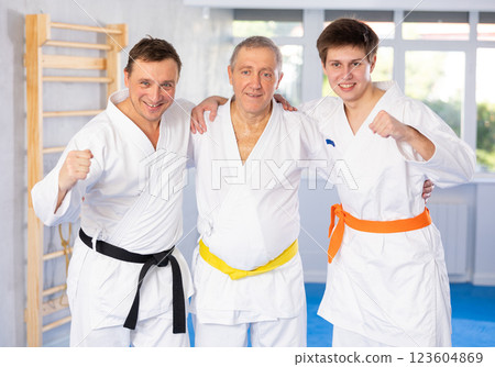 Portrait of martial arts fighters of different ages after karate or judo training Portrait of martial arts fighters of different ages after karate or judo training 123604869