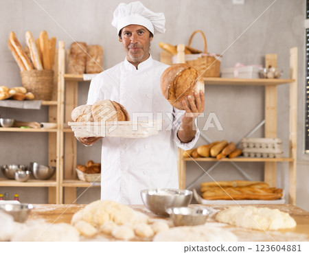 Adult male baker with homemade bread Adult male baker with homemade bread 123604881