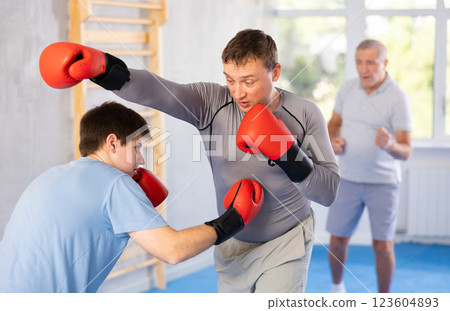 Two men training boxing fight in studio 123604893