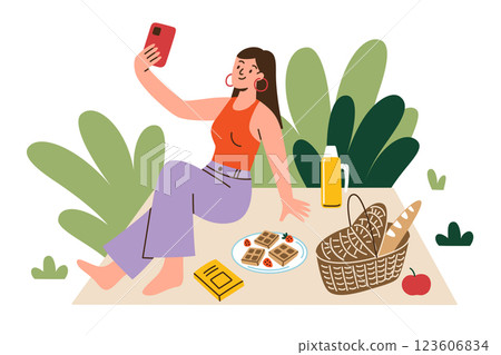 Vector illustration of young woman enjoying picnic outdoors. Flat cartoon female character sitting on blanket, taking selfie with phone. Picnic basket, food, thermos, leisure and relaxation in nature 123606834