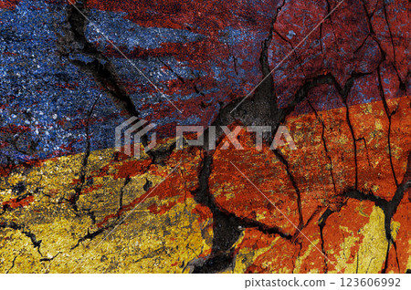 Dirty Ukrainian flag with blood. Ukrainian flag painted on a cracked wall. Distressed flag of Ukraine. 123606992