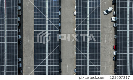Top view of car park with solar panels, Innovative solar panels photovoltaic installation located on car parking lot rooftops, Alternative sustainable resource eco power. 123607217