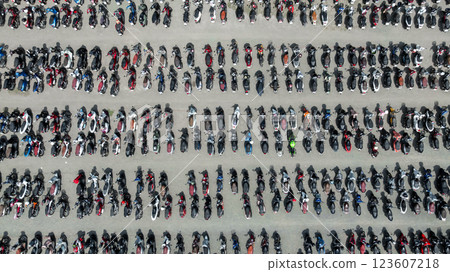 Top view row of motorcycles parked on street, Motorcycles parked on the motorcycles parking lot, Aerial view of motorcycles parking row on concrete floor. 123607218