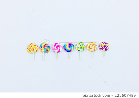 Sweet food lollipop on white background, Set of colorful lollipops isolated on white background, Colorful lollipops swirls, Spiral multicolor candy on white background, Top view Sweet food lollipop on white background, Set of colorful lollipops isolated on white background, Colorful lollipops swirls, Spiral multicolor candy on white background, Top view 123607489