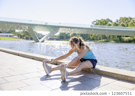 Woman doing yoga or stretching Woman doing yoga or stretching 123607551