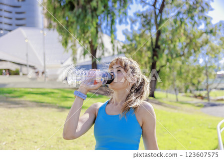 Foreign senior woman hydrating 123607575