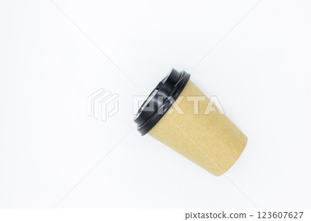 Brown paper coffee cup with black lid on white background, Brown paper cup blank coffee cup for takeaway on white background, Brown empty paper cup for coffee eco coffee cafe. Brown paper coffee cup with black lid on white background, Brown paper cup blank coffee cup for takeaway on white background, Brown empty paper cup for coffee eco coffee cafe. 123607627