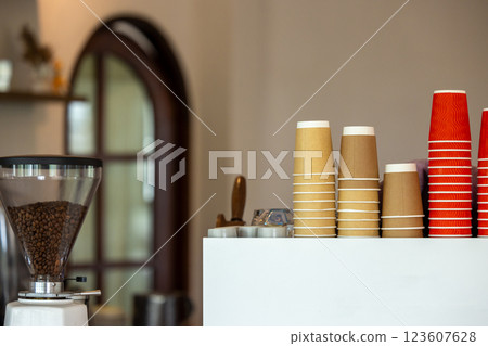 Brown and red paper coffee cups use from coffee cafe, restaurants, takeaways, Recycling paper cups on coffee espresso machine in coffee cafe. 123607628