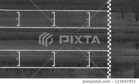 Start or finish line on car race, Start and finish line racing, Grid start race track, Top view textured and background grid start on the asphalt road race track abstract. Start or finish line on car race, Start and finish line racing, Grid start race track, Top view textured and background grid start on the asphalt road race track abstract. 123607955