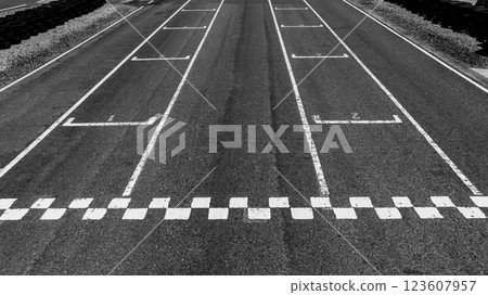 Start or finish line on car race, Start and finish line racing, Grid start race track, Top view textured and background grid start on the asphalt road race track abstract. 123607957