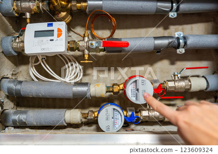 Smart water and heat meters with remote data transmission installed in a European utility system. The concept represents modern energy efficiency and digital infrastructure development 123609324