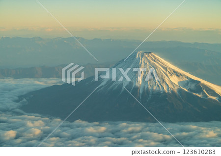 Beautiful Mount Fuji illuminated by the morning sun seen from above (aerial view) 123610283