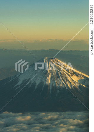 Beautiful Mount Fuji illuminated by the morning sun seen from above (aerial view) 123610285