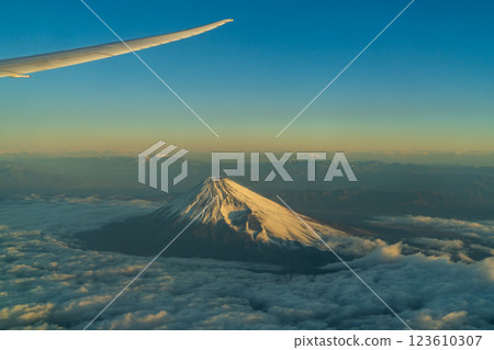 Mt. Fuji in winter with the morning sun on a flight over Mt. Fuji (aerial view) Mt. Fuji in winter with the morning sun on a flight over Mt. Fuji (aerial view) 123610307
