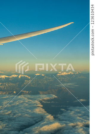 The Japanese Alps in the morning sun as seen from an airplane 123610434
