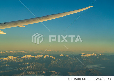 The Japanese Alps in the morning sun as seen from an airplane 123610435