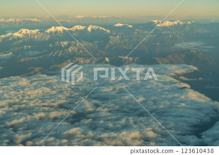 The Japanese Alps in the morning sun as seen from an airplane 123610438