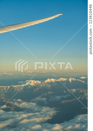 The Japanese Alps in the morning sun as seen from an airplane The Japanese Alps in the morning sun as seen from an airplane 123610446