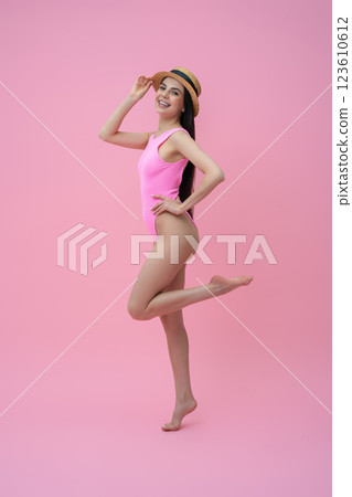 Enjoyed pretty young woman in pink bodysuit and straw hat Enjoyed pretty young woman in pink bodysuit and straw hat 123610612