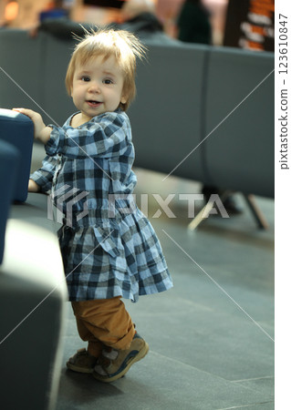 Happy baby girl waiting check in Happy baby girl waiting check in 123610847