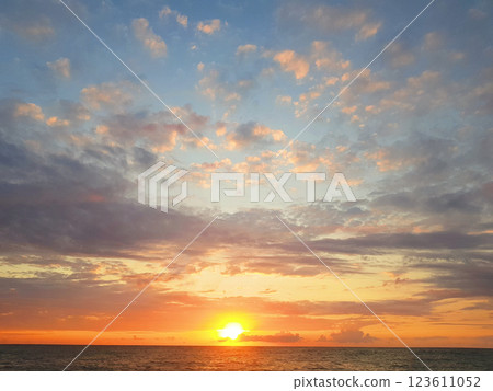 Sunset on sea beach. Beautiful nature background. Sky, clouds and sun light 123611052